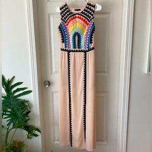 Colorful formal dress with rainbow and black embroidery pattern.